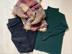 Dark jeans, green sweater, plaid scarf, and suede booties; all part of fall fashion for Kara