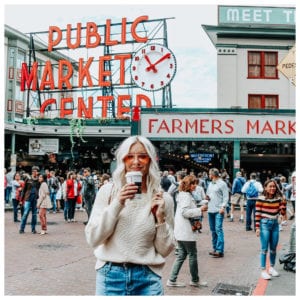 Carly @CarlyMal is a trend setter based in Kelowna, here wearing a sweater and jeans in the market with a coffee