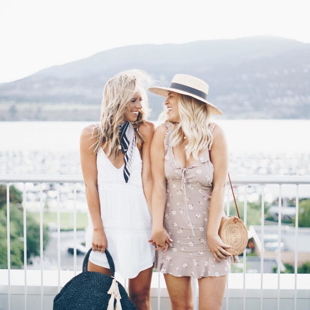 Jordan Sangster (@Jsangsterr) is a Kelowna-based blogger that loves to travel; here she is standing against a beautiful Okanagan lake view with a friend, wearing a white dress